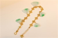 A Jadeite and Gold Bracelet