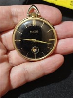 Vintage wind-up pocket watch with date window.