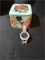 Fossil wristwatch and original tin. Not tested a