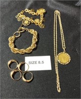 Group of gold plate identical rings, bracelets,