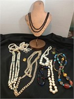 Group of costume jewelry, mostly necklaces