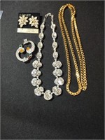 Monet costume jewelry . Goldtone chain is 36".