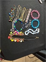 Colorful costume jewelry bracelets and necklaces