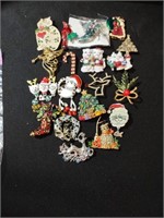 Group of 19 Christmas brooches. Some enamel, some