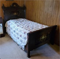 Antique bed with quilt