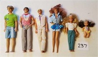 Assorted Barbie and Ken dolls