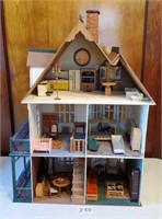 Large wooden doll house furnished