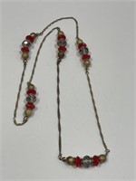 GOLD TONE NECKLACE WTH CRYSTALS & RED BEADS