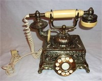 Brass rotary dial telephone.