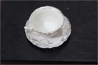A Miniature Ceramic Cup and Saucer