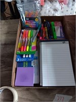 Box of notepads highlighters  and more.