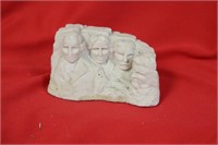 A Cement Mount Rushmore