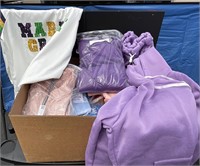 Box with new Amazon clothes various sizes