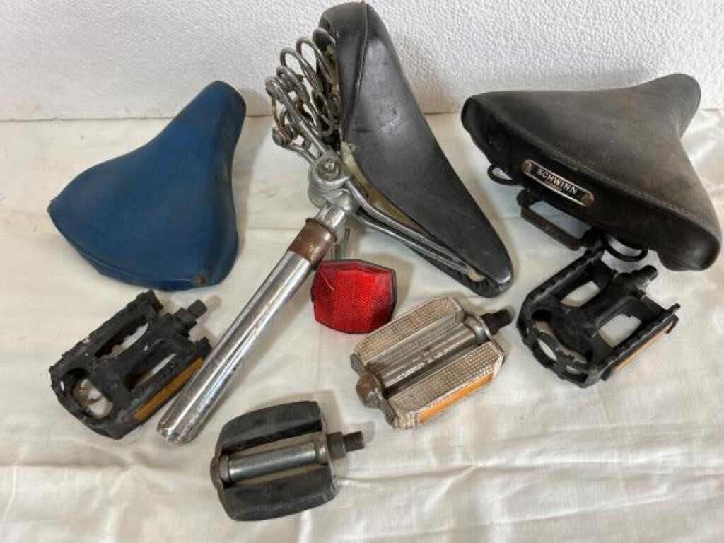 Bicycle parts lot. Seats. pedals.
