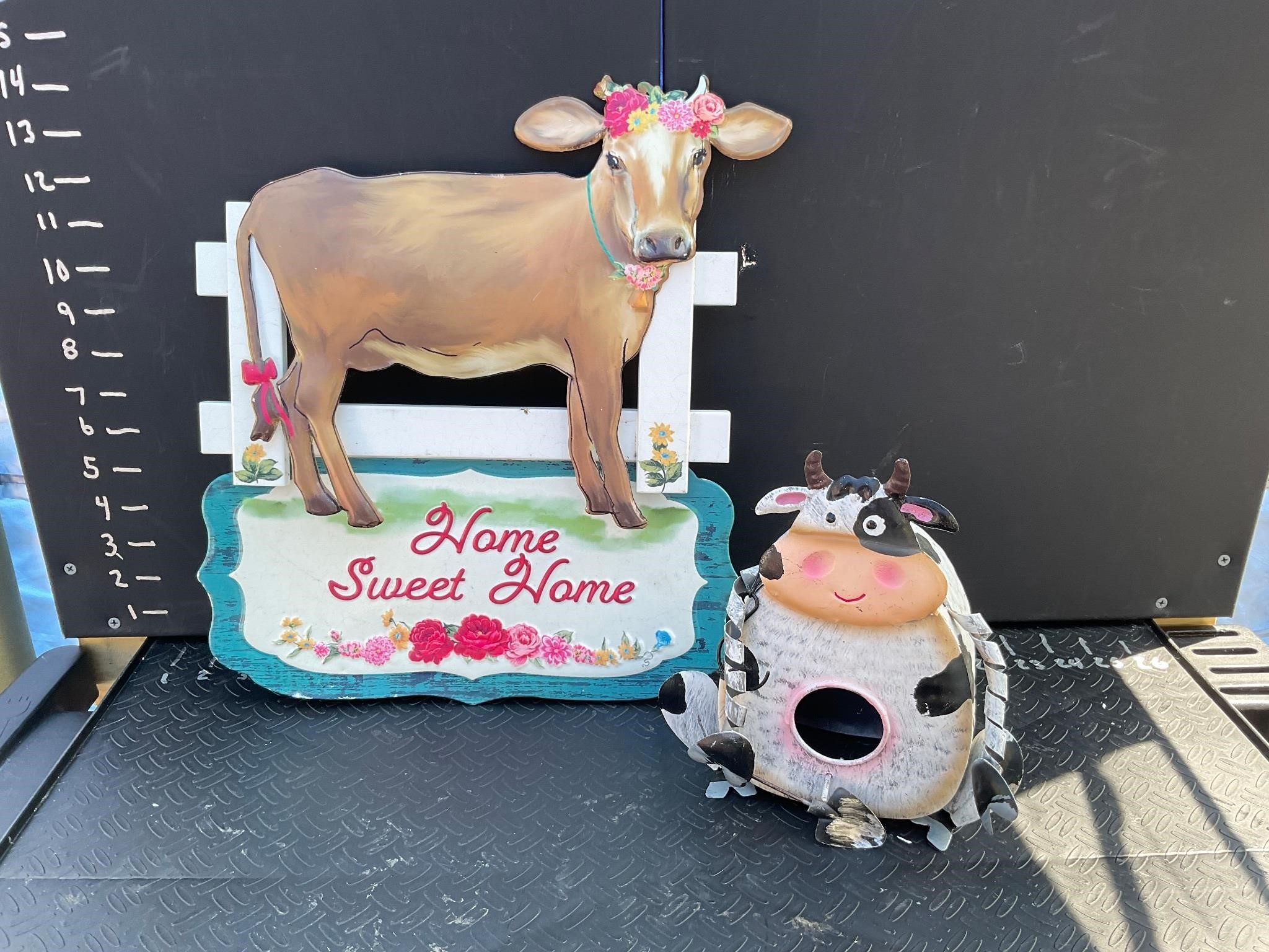 Metal cow sign and cow birdhouse