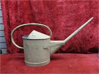 Old galvanized watering can.