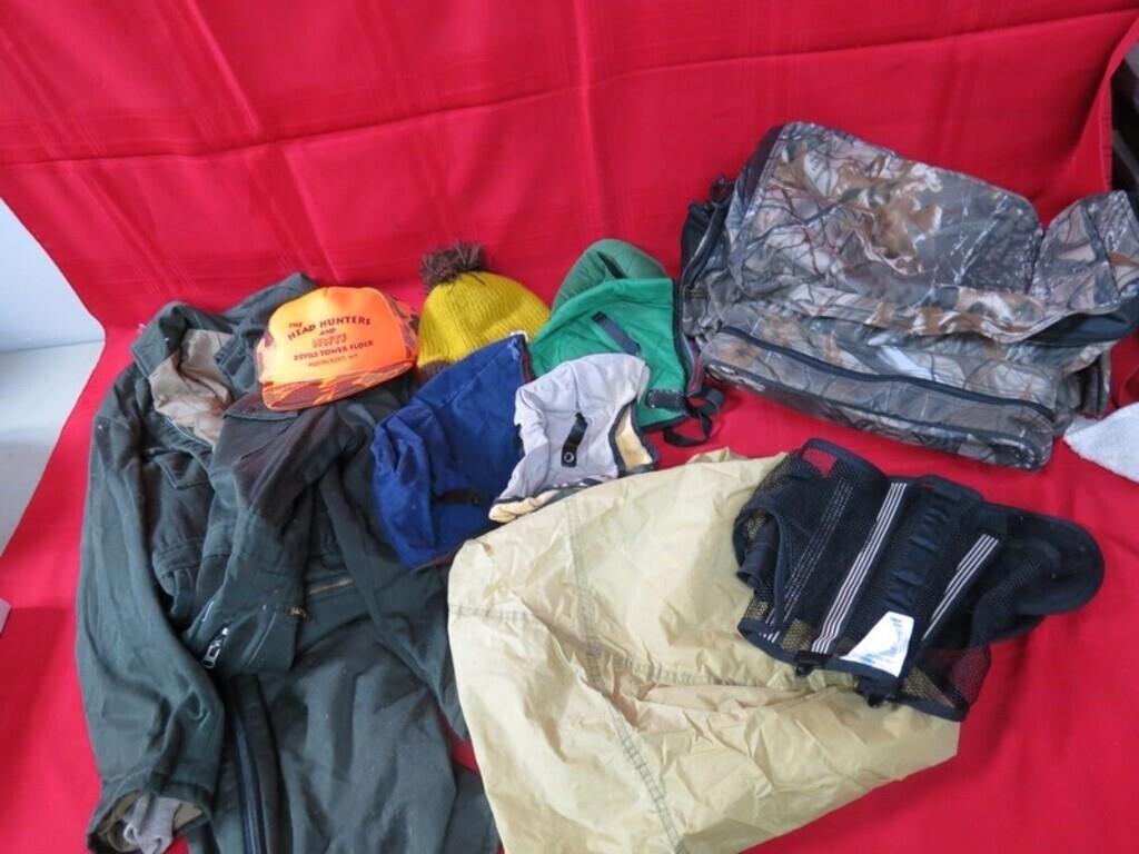 Assorted hunting clothes and hats lot.