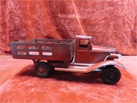Vintage Girard pressed steel stake bed truck.