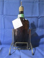 Whiskey Bottle on swinging metal stand