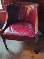 Leather club chair on casters.   Look at the