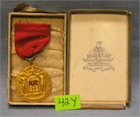 Early gold filled basketball medal and ribbon