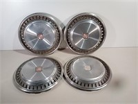 Four Vintage Chevy Hubcaps