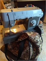 Singer sewing machine in carry case