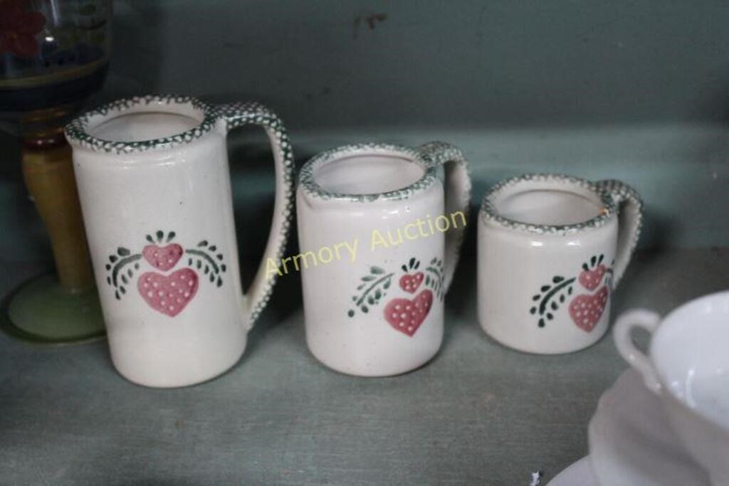 HEART DECORATED POTTERY MEASURING PITCHERS