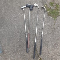 assorted putters and wedges