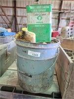 Bucket with Oil and Unopened can of Bin Spray