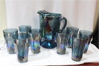 A Carnival Glass Pitcher and Tumbler
