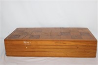 A Wooden Chess Board with Onyx Chess Pieces