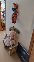 Porcelain doll, canvas art, & bunny on chair