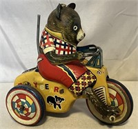 1950's tin litho bear on a tricycle.