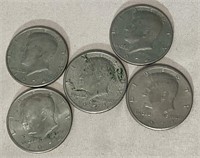 5 American JFK half dollars.