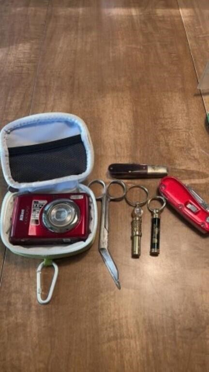 Case XX pocket knife, Nikon Coolpix red camera,