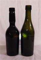 2 unmarked blob top glass bottles, one is green