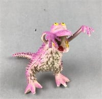 Purple spiky dinosaur figure