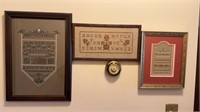 Three framed cross stitch works, one with pink