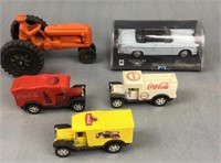 3 plastic Coke trucks, tractor & a car