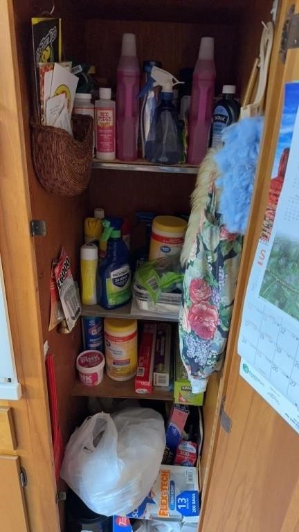 Large kitchen closet filled with cleaning