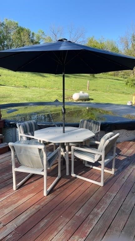 PVC table with four chairs, glider and lounger.