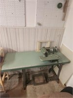Vintage sewing machine with work table