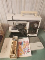 Vintage Kenmore sewing machine w/attachments