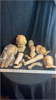 Lot of doll parts and straw stuffed body