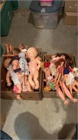 2 boxes of Barbie and baby dolls