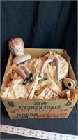 Box of porcelain doll parts