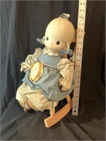 Precious moments porcelain doll and rocker. In
