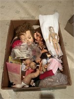 Box of misc dolls, parts, and more