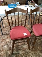 Pair of wooden chairs with cushions